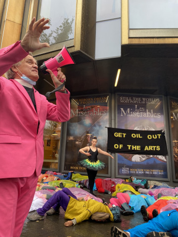 Reverend Billy preaches while the BP ballet dancer dances. Photo by BP or not BP?